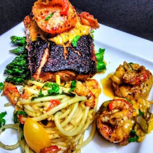 A salmon and crawfish dish with pasta prepared by Shaheed